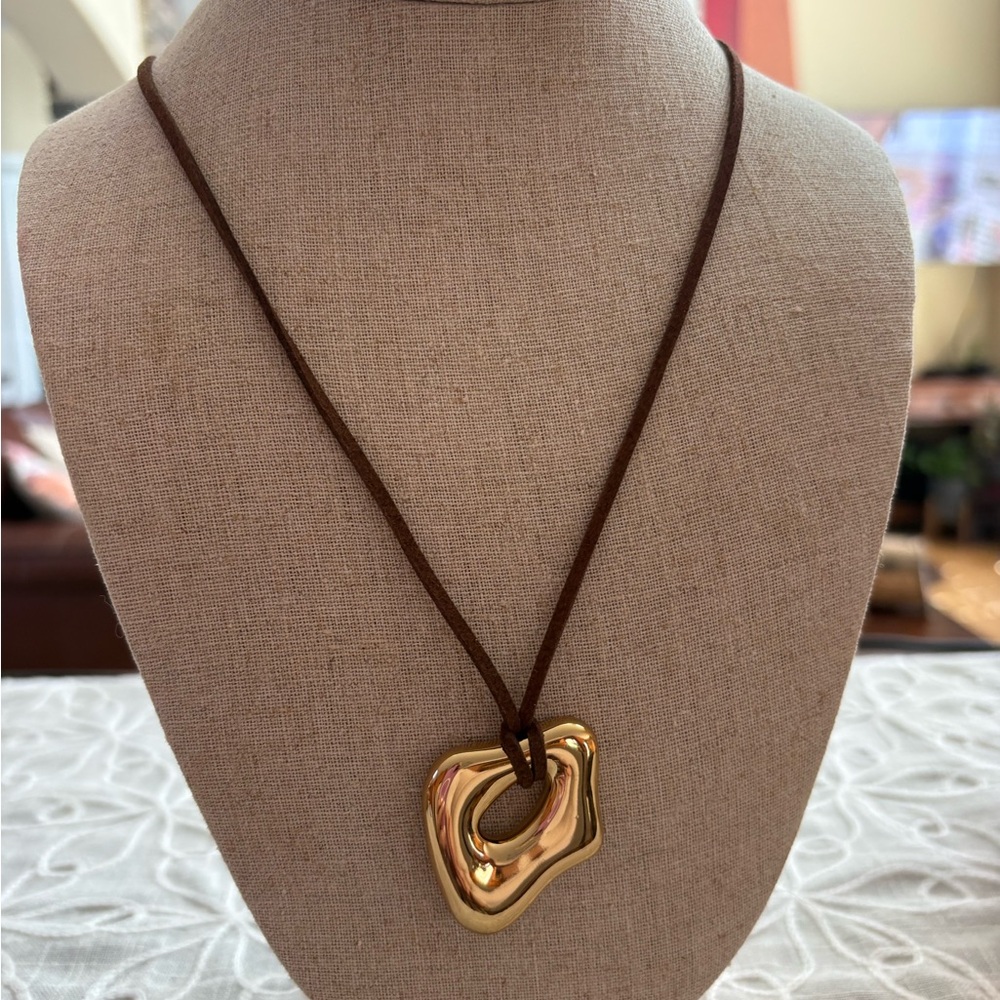 Elegant Gold Sculpture Long Pendant Necklace on Brown Cord - Picture 3 of 9